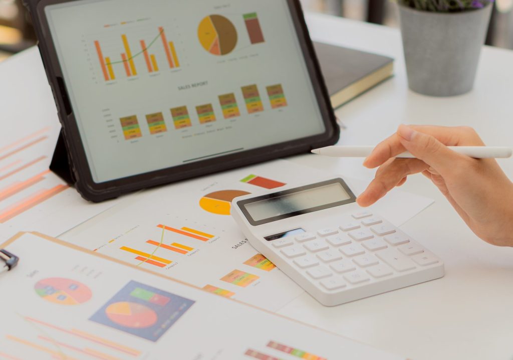 Businessman’s,Hands,Are,Analyzing,Charts,,Graphs,,Financial,Data.,And,Accounting Businessman's,Hands,Are,Analyzing,Charts,,Graphs,,Financial,Data.,And,Accounting